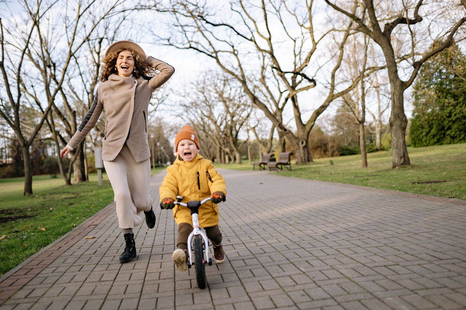 A mother and child enjoying a ride through the park